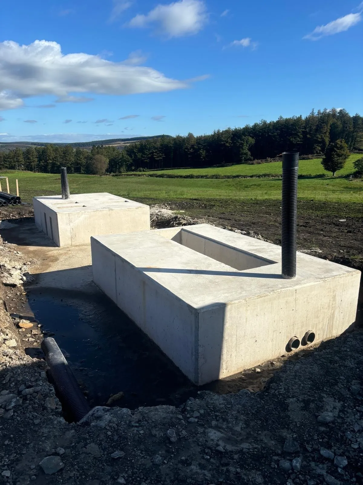Concrete plinth with cut-outs cast on a utility site